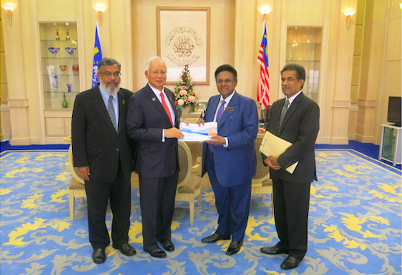 Samy Vellu (second from right) handling the documents to PM Najib at the PMO in Putrajaya today. Dr Denison is on the left.