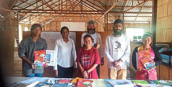 A walk to remember: Baldape (centre, in white shirt) and Javnesh (second from right) with the orang asli children at Pos Senderut, Pahang. - PHOTO THE STAR