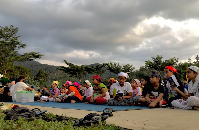 OUTDOOR RAHERAS: The younger participants of the Annual Gurmat Parchaar Samelan, called the Mighty Khalsa, are reading the evening prayer Raheras outdoors - PHOTO / JAGDESH SINGH