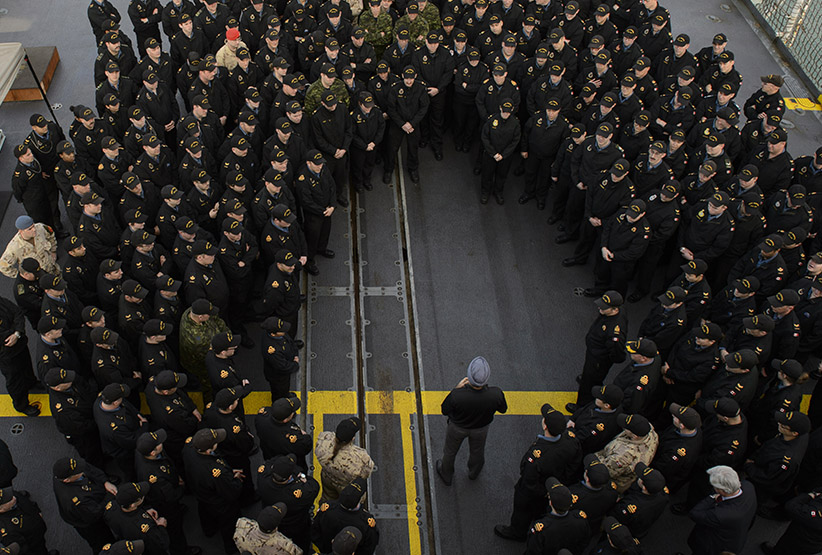The Honourable Harjit S. Sajjan, Minister of National Defence, addresses the ship’s company of Her Majesty’s Canadian Ship WINNIPEG on the ship’s flight deck during his visit to the ship on December 23, 2015 during Operation REASSURANCE. (Cpl Stuart MacNeil/NCSM Winnipeg Camera)