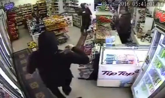 A footage showing a Sikh father-son shopkeepers taking on two armed robbers - PHOTO / ASIA SAMACHAR