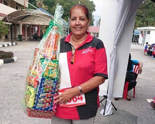 Ranjit Kaur with the hamper for winning the retiree category of the Ipoh run - PHOTO / SUPPLIED