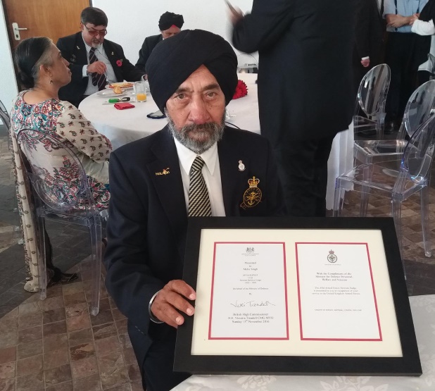Meha Singh Kishen Singh receives the HM Armed Forces Veterans Badge during he Remembrance Day 2016 in Kuala Lumpur organised by the British High Commission - PHOTO / British High Commission Facebook 